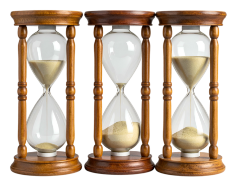 Three antique hourglasses with sand running through