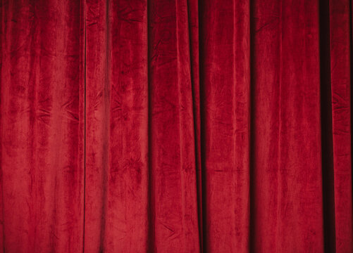 Red velvet curtain background with festive Christmas mood indoors