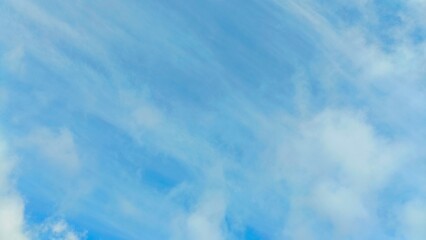 Minimalistic landscape in blue tones of cloudy sky over horizon evoking tranquility