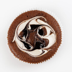 Beautiful chocolate cake with jam and cream on a white background.