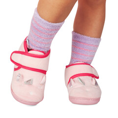 babygirl in unicorn slippers isolated on white background
