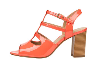 Isolated view of a fashionable high heel sandal against a plain backdrop in vibrant orange hue