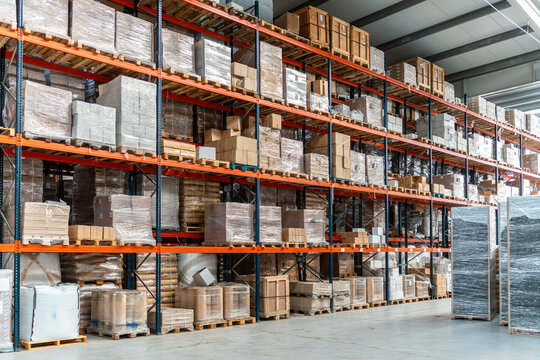 Commercial logistics warehouse storing goods on tall racks