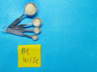 A conceptual image for World Diabetes Day showing a finger dividing a line of sugar to represent health awareness and prevention