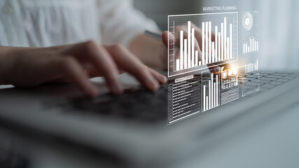 A business professional engaged in digital marketing planning, typing on a laptop with insightful graphs and charts overlaying for performance analysis. Impute