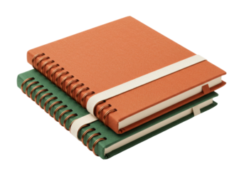 Isolated spiral bound notebooks in green and orange with elastic closure, study tools