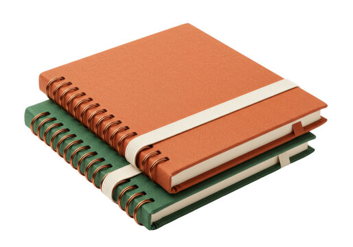 Isolated spiral bound notebooks in green and orange with elastic closure, study tools