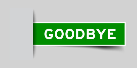 Green color square shape sticker label with word goodbye inserted in gray background
