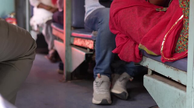 Cinematic view inside a general train coach in India, showing people sitting and traveling together. The scene reflects the real rhythm, emotions, and raw atmosphere of Indian railway journeys.