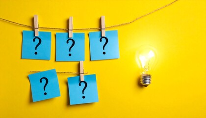 Blue question mark notes on a string next to a bright lightbulb, against a vibrant yellow background