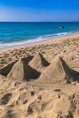 Pyramids made of sand on the beach