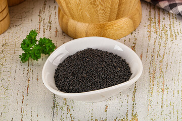 Black dry Nigella seeds in the bowl