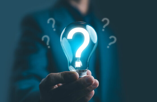 Creative concept of innovation and problem-solving idea, showing a glowing light bulb with a question mark symbol, representing curiosity, decision-making, business strategy, and brainstorming.