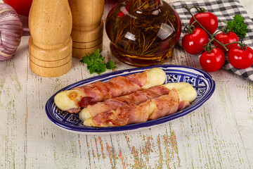 Hot mozzarella sticks with bacon