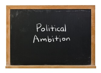Political ambition written in white chalk on a black chalkboard isolated on a wooden frame