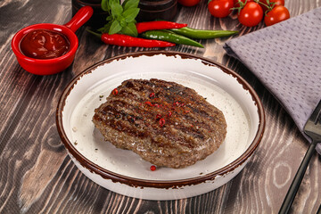 Grilled beef burger cutlet with sauce