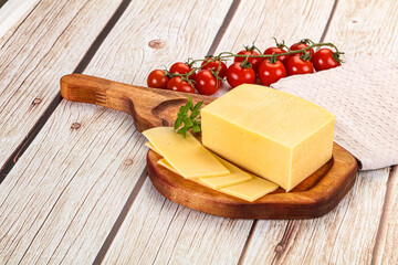 Yellow cheese piece with slices