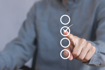 Businessman checks correct approval, acceptance, quality assurance concept, assessment, questionnaire, evaluation, online survey, online exam, checklist.