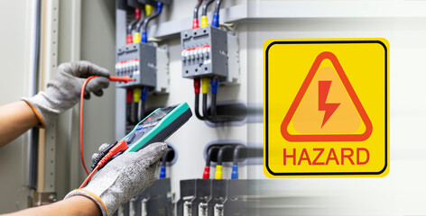 Electrical hazard warning sign with industrial electrical control engineer background
