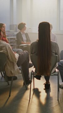 Diverse Group of Students Participates in Classroom Talk on Mental Health Guided by Compassionate Teacher. Concept Empathy, Open Communication, and Psychological Safety in Education. Vertical Shot.