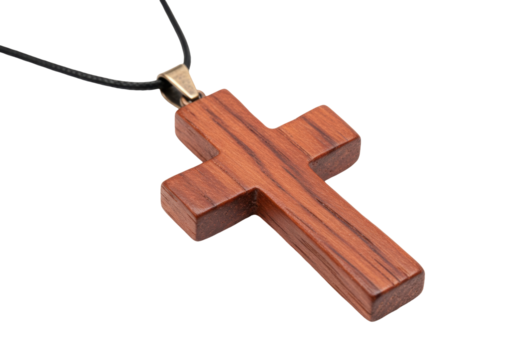 Isolated Christian cross pendant necklace on black cord, religious jewelry item, crucifix, faith