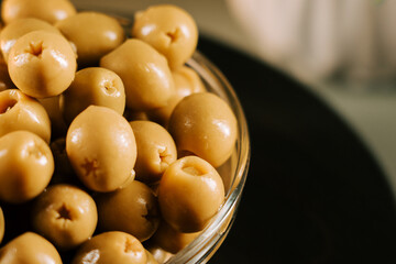 Olive display in a glass bowl showcasing their rich texture and color