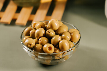 Fresh olives in a clear bowl ready for a delicious appetizer or snack