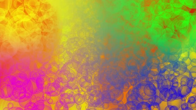 Dynamic orange and green particles forming a lively abstract motion texture.