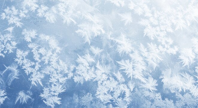 A winter scene featuring a close-up view of intricate ice crystals and frost formations covering a glass surface. The delicate, snowflake-like patterns create a beautiful, serene and icy visual.