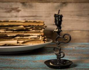Vintage Black Candle and Old Books—Dark Academia and Gothic Still Life