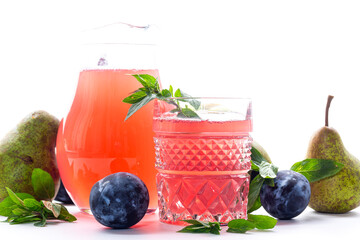Natural fruit juice from pears and plums with mint leaves