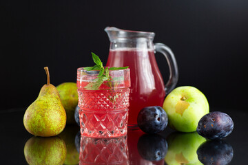 Bright fruit drink for a diet with pears and plums © Peredniankina