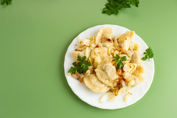 Tasty homemade dumplings with crispy onion and bacon topping