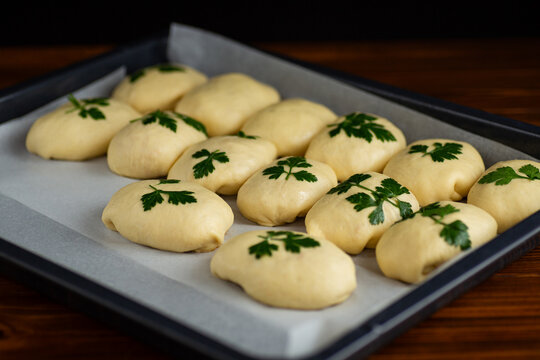 Soft dough preparation for homemade bread with fresh parsley