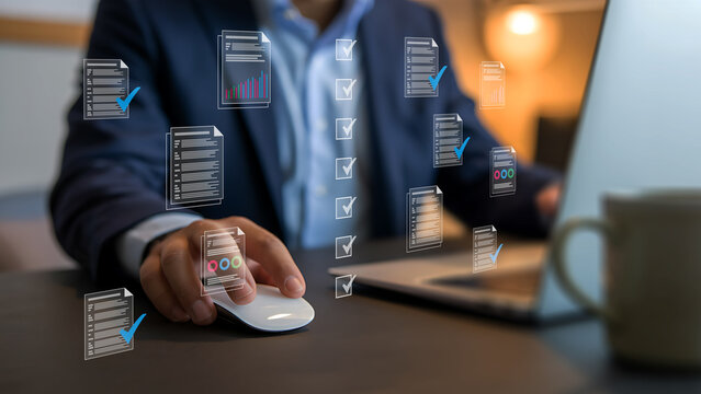 Businessman uses computer mouse with holographic data overlays