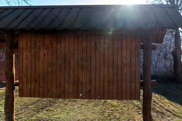 Mock-up billboard with blank space for advertisement in a rural outdoor setting