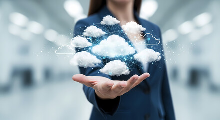 A businesswoman in a suit holds a digital cloud of data, representing cloud computing, data storage, and the future of technology in a modern office.