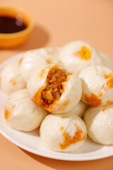 Traditional Chinese Xiaolongbao Dumplings with Carrot Vermicelli Filling and Tea