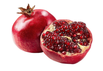 Vibrant red pomegranate, one whole and one halved, revealing seeds