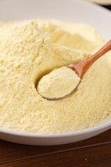 Ground Rice Flour Powder in Bowl with Wooden Spoon - Gluten Free Baking Ingredient