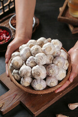 Fresh Garlic Bulbs in Wicker Basket - Traditional Kitchen Cooking Ingredients