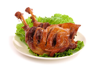 Roasted Duck with Crispy Skin and Lettuce Garnish on White Plate
