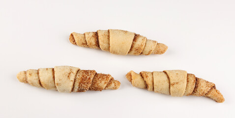 Delicious cinnamon cookies. Three cinnamon cookies on a white background.