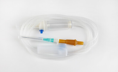 Infusion system for intravenous administration of drugs on a white background . IV Set Infusion .Intravenous drip system .