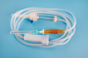 Infusion system on a blue background. IV Set Infusion. Intravenous drip system.