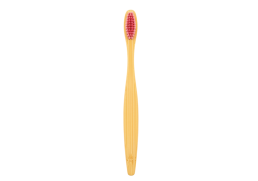 Isolated wooden toothbrush with pink bristles for dental care and personal hygiene use