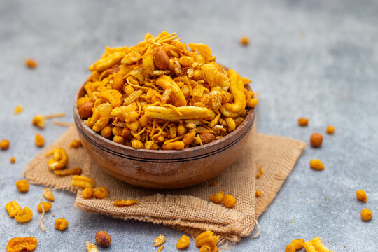 Bombay mix is a spicy, crunchy Indian snack blend of fried lentils, nuts, chickpea flour noodles, and aromatic spices.
