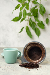 Cup of espresso and filter with coffee grounds, lifestyle concept, wake up in the morning, hot drink with caffeine, take a break