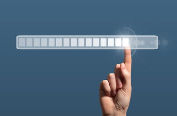 Futuristic digital interface showing a hand interacting with a loading bar that represents progress,
