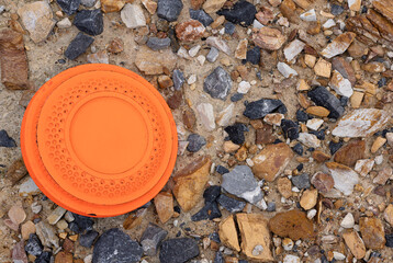 Flying disk target on many rock texture background , Clay Shooting game